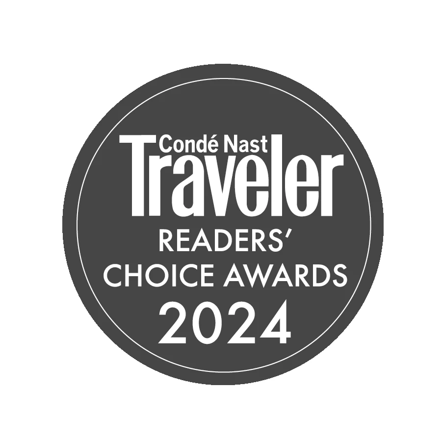 A round badge reading &ldquo;Cond&eacute; Nast Traveler Readers&rsquo; Choice Awards 2024&rdquo; in white text on a dark background. logo on footer section.